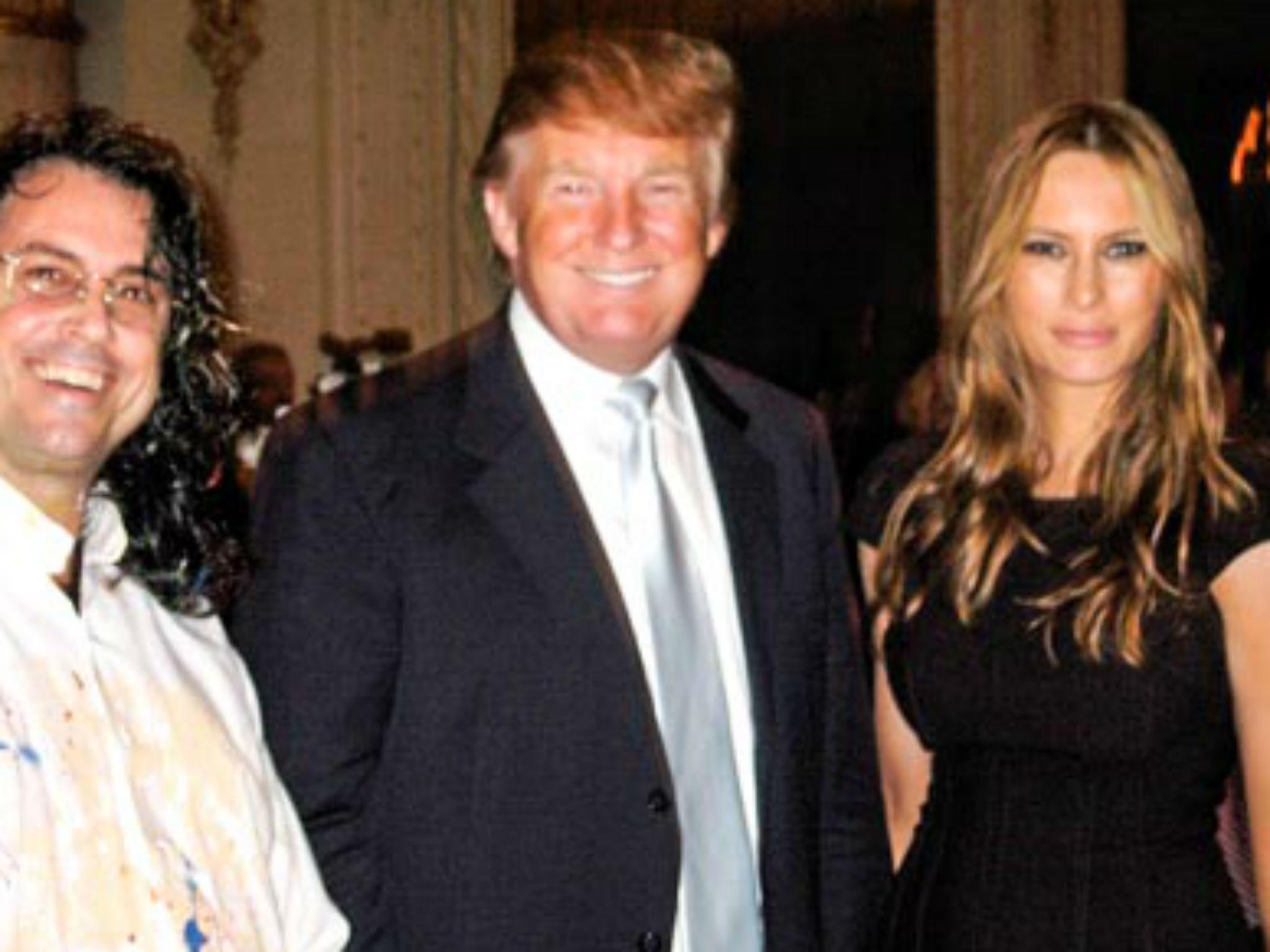 &#13;
Michael Israel beside Donald and Melania Trump in 2007 &#13;