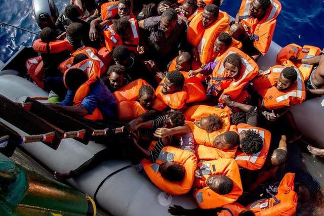 Medecins Sans Frontieres shows people board the Bourbon Argos during a rescue operation in the Mediterranean Sea