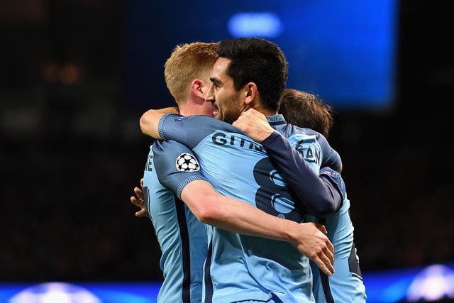 Ilkay Gundogan celebrates with teammates after putting Manchester City 3-1 up