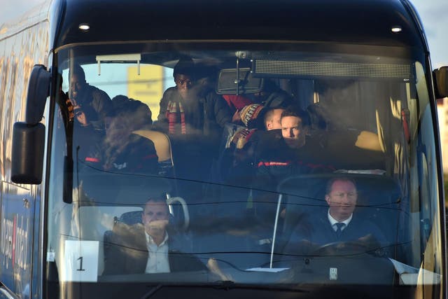 Unaccompanied minors living near the demolished Jungle camp in Calais, housed in specially outfitted shipping containers, are pictured in a bus leaving for a reception centre