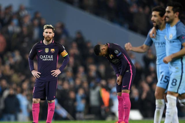 Lionel Messi reacts after seeing Manchester City secure a 3-1 victory over Barcelona