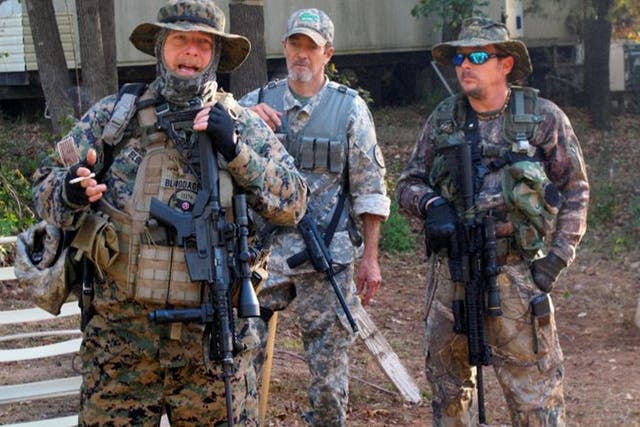Chris Hill, leader of the Georgia chapter of the III% Security Force, left, who also goes by the name Bloodagent