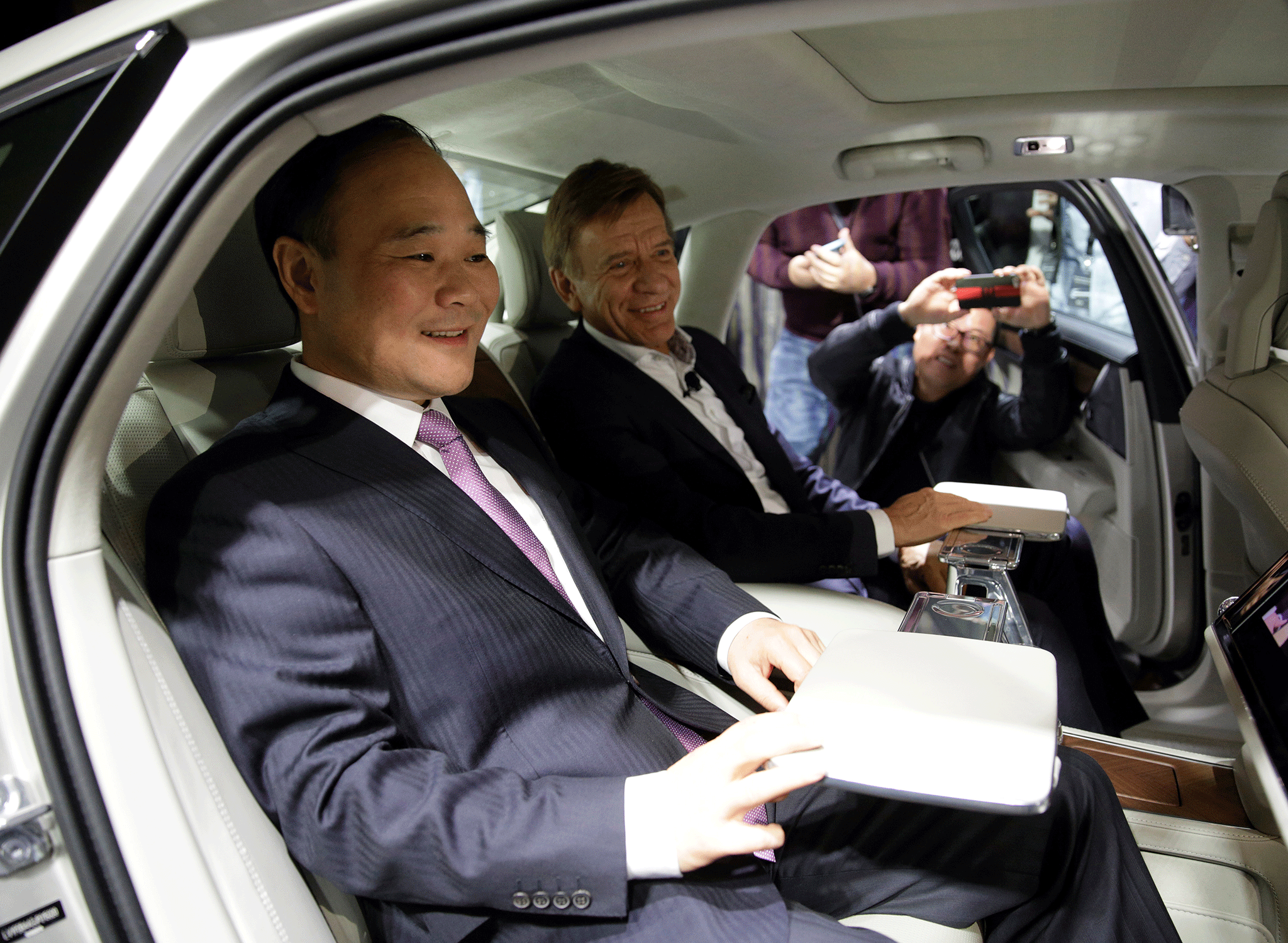 Li Shufu, founder and chairman of Geely Holding Group and Hakan Samuelsson, President and CEO of Volvo attend Volvo's S90 launch