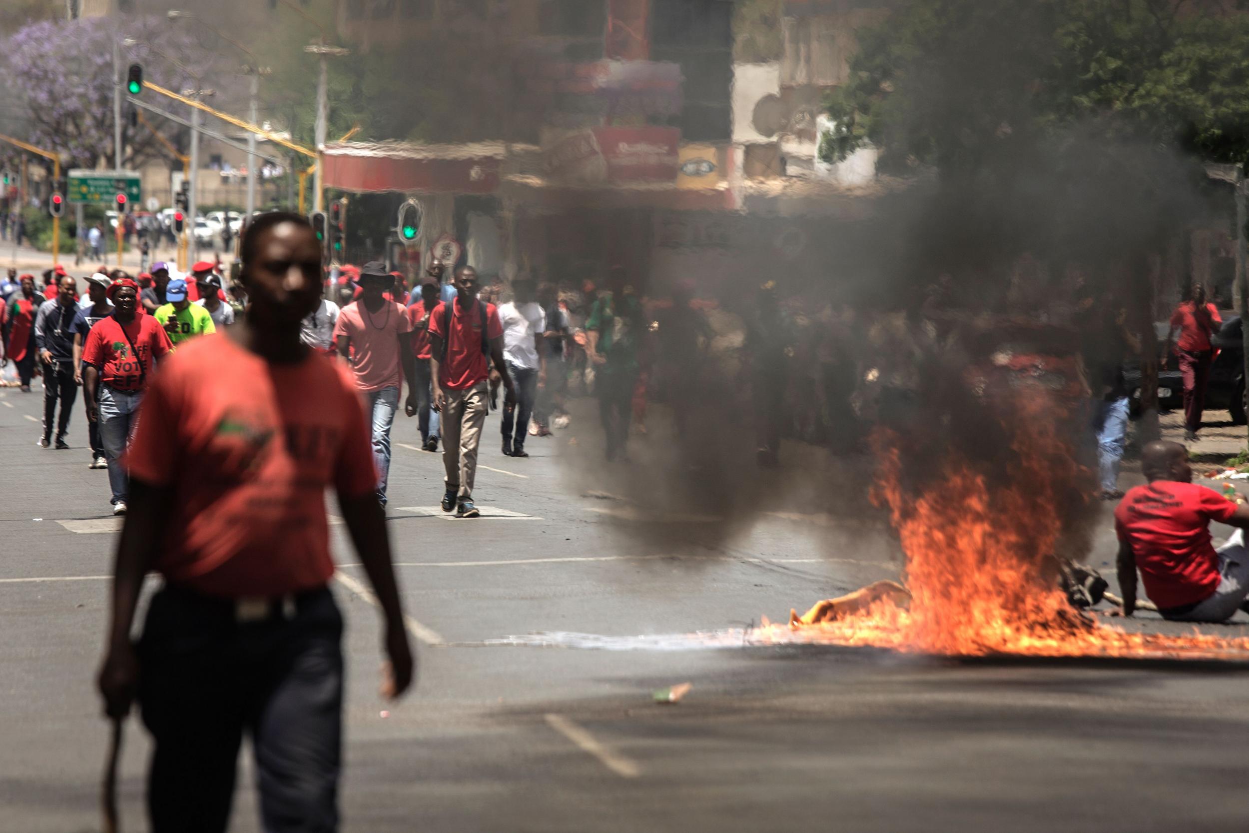 Opposition party supporters protest against President Zuma in Pretoria on Wednesday