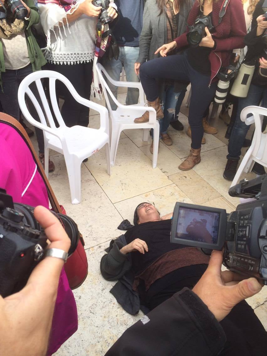 Female protesters attempting to make their way to the Wall were knocked down by Orthodox demonstrators