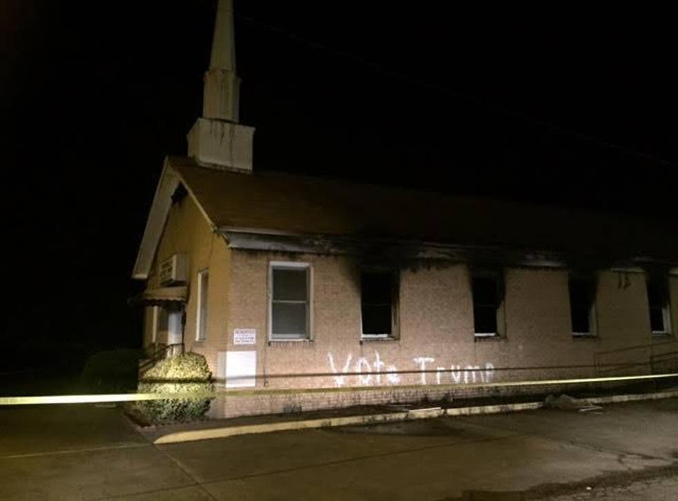 The church was 'heavily charred' after being set alight, and the words 'Vote Trump had been spray-painted on its exterior