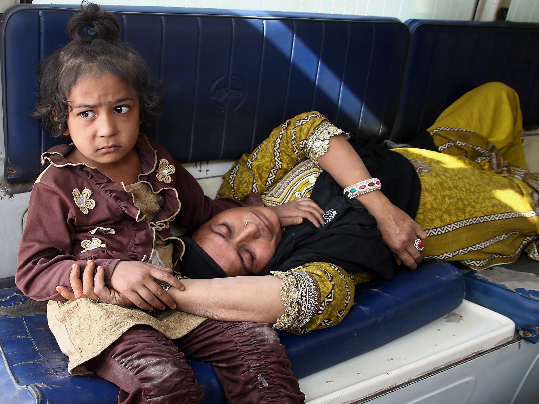 People transfer an injured victim to a hospital