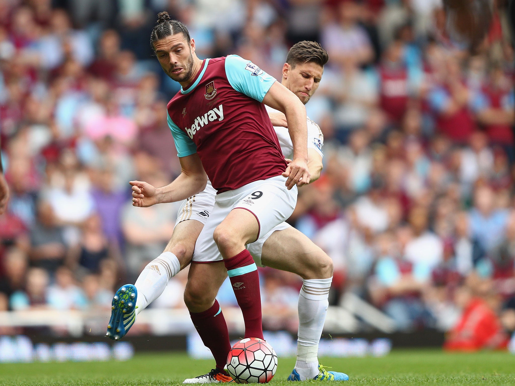 Carroll in action for West Ham against Swansea