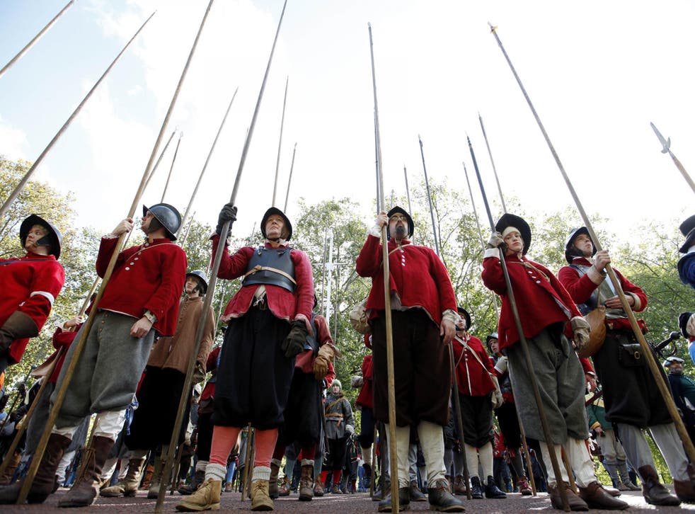 Members of the English Civil War Society hold their pikes after parading down the Mall in London