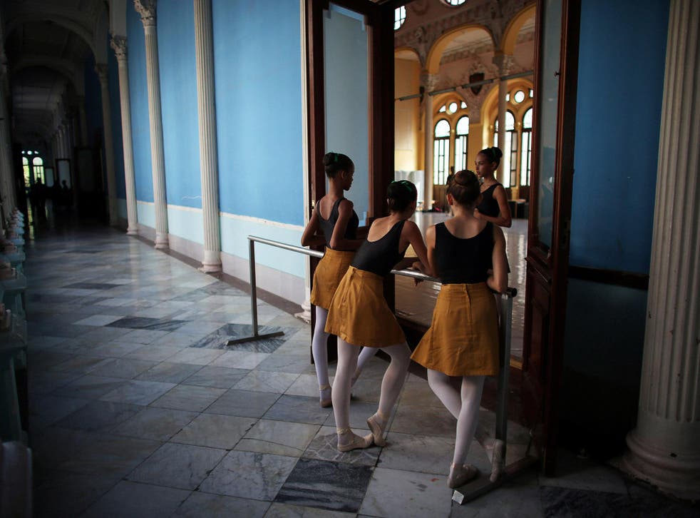 Students at Cuba's National Ballet School chat during a break