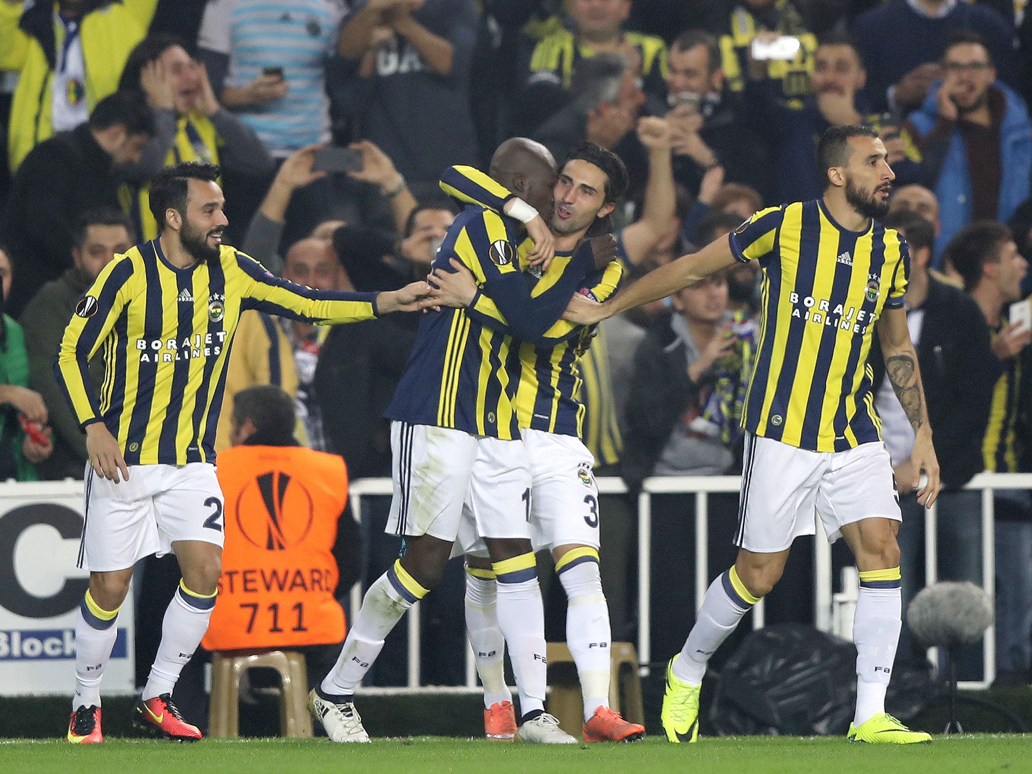 Moussa Sow is congratulated by his teammates following his spectacular volley in the opening minutes of the match