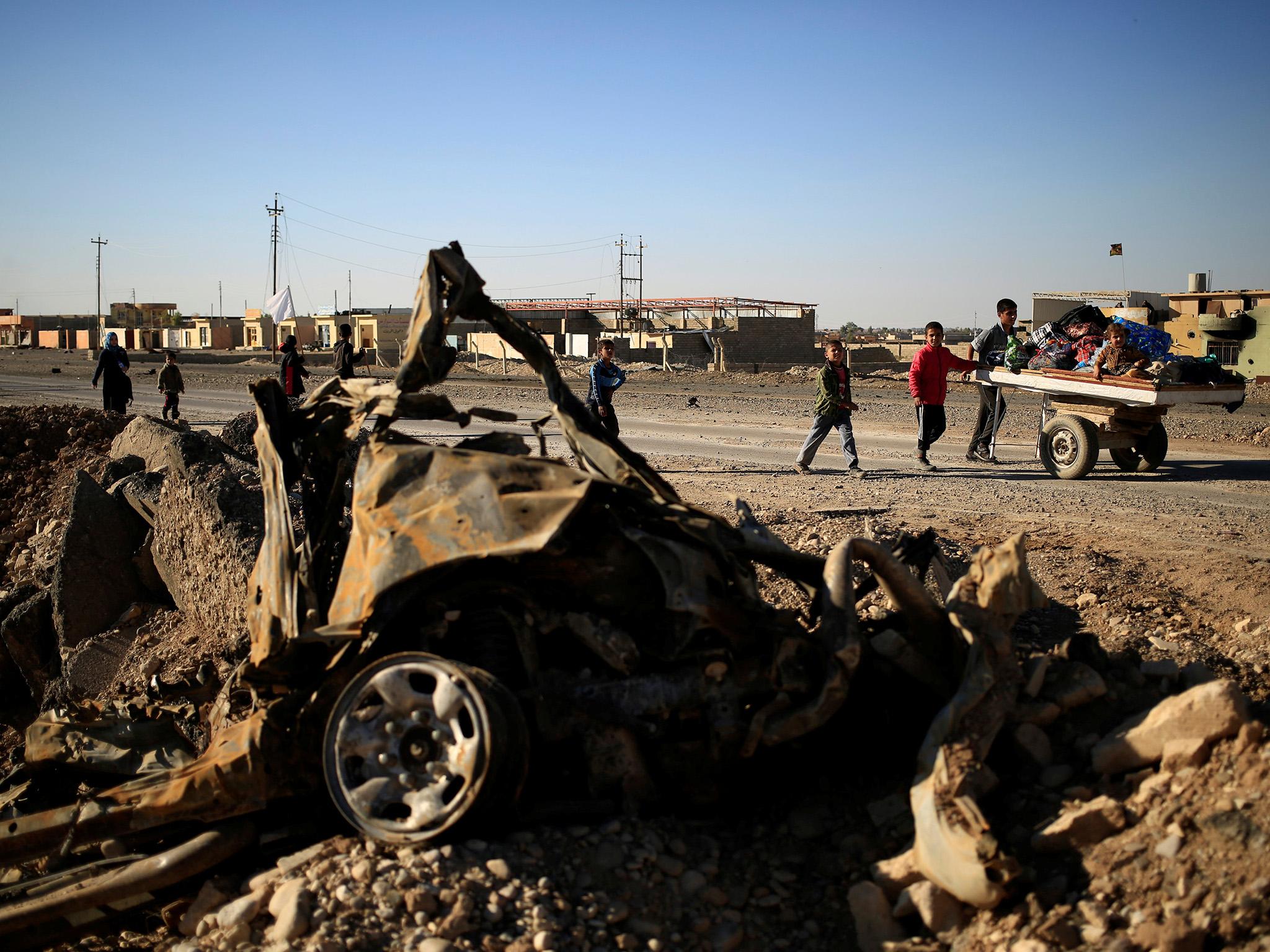 The remains of a car bomb in east Mosul on Thursday, where local resistance units are reportedly ambushing and assassinating Isis officials