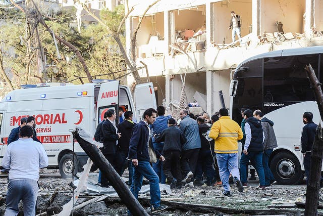Turkish rescue officials and people carry an injured man to an ambulance following a separate explosion in Diyarbakir (file photo)