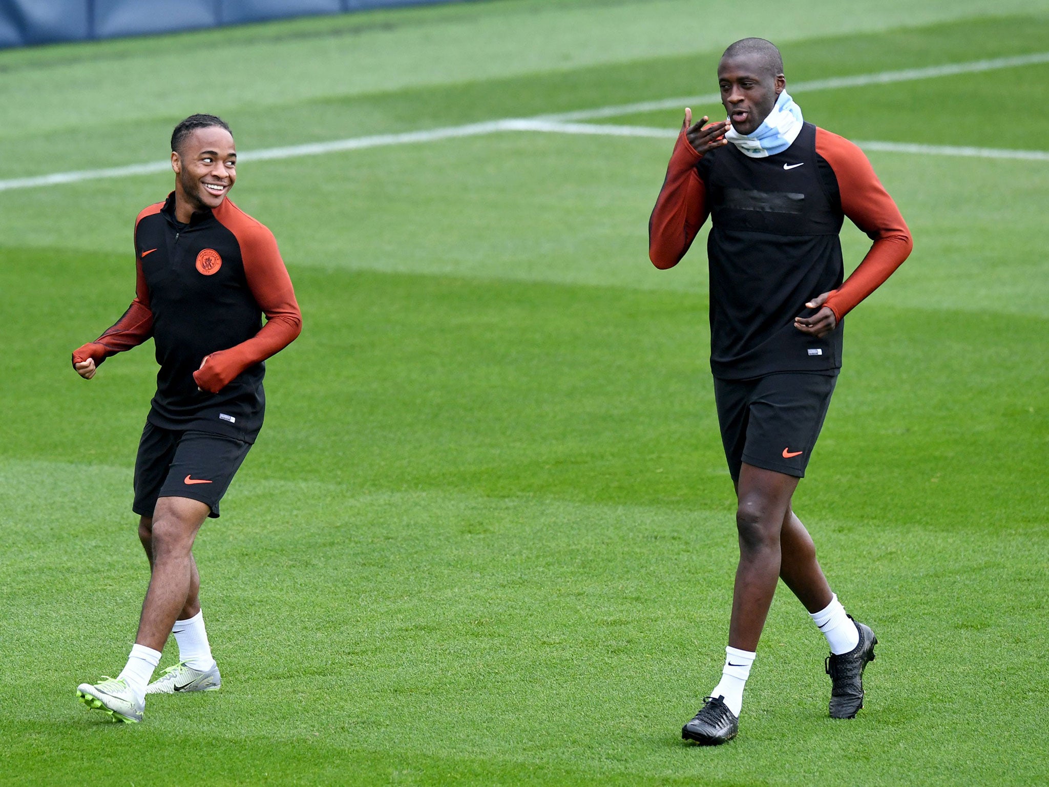 Yaya Toure in training with Raheem Sterling