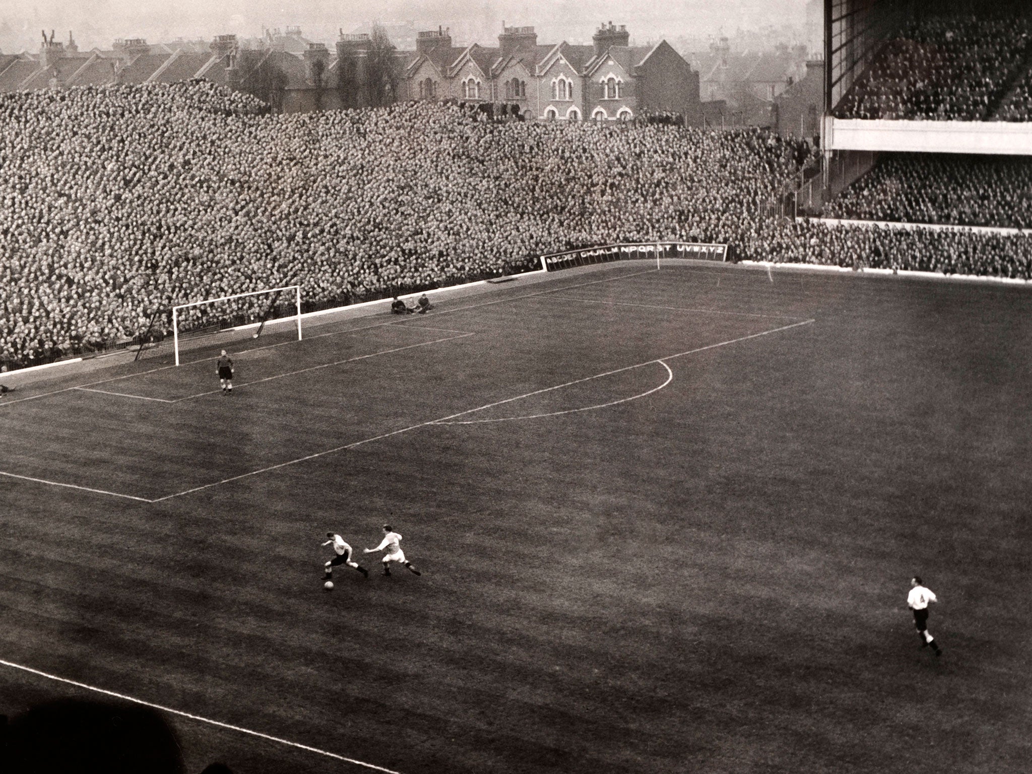 A match at Arsenal's former ground Highbury back in the 1930s. Originally Arsenal were not allowed to play on Christmas Day or Good Friday at the ground as it was owned by the Church
