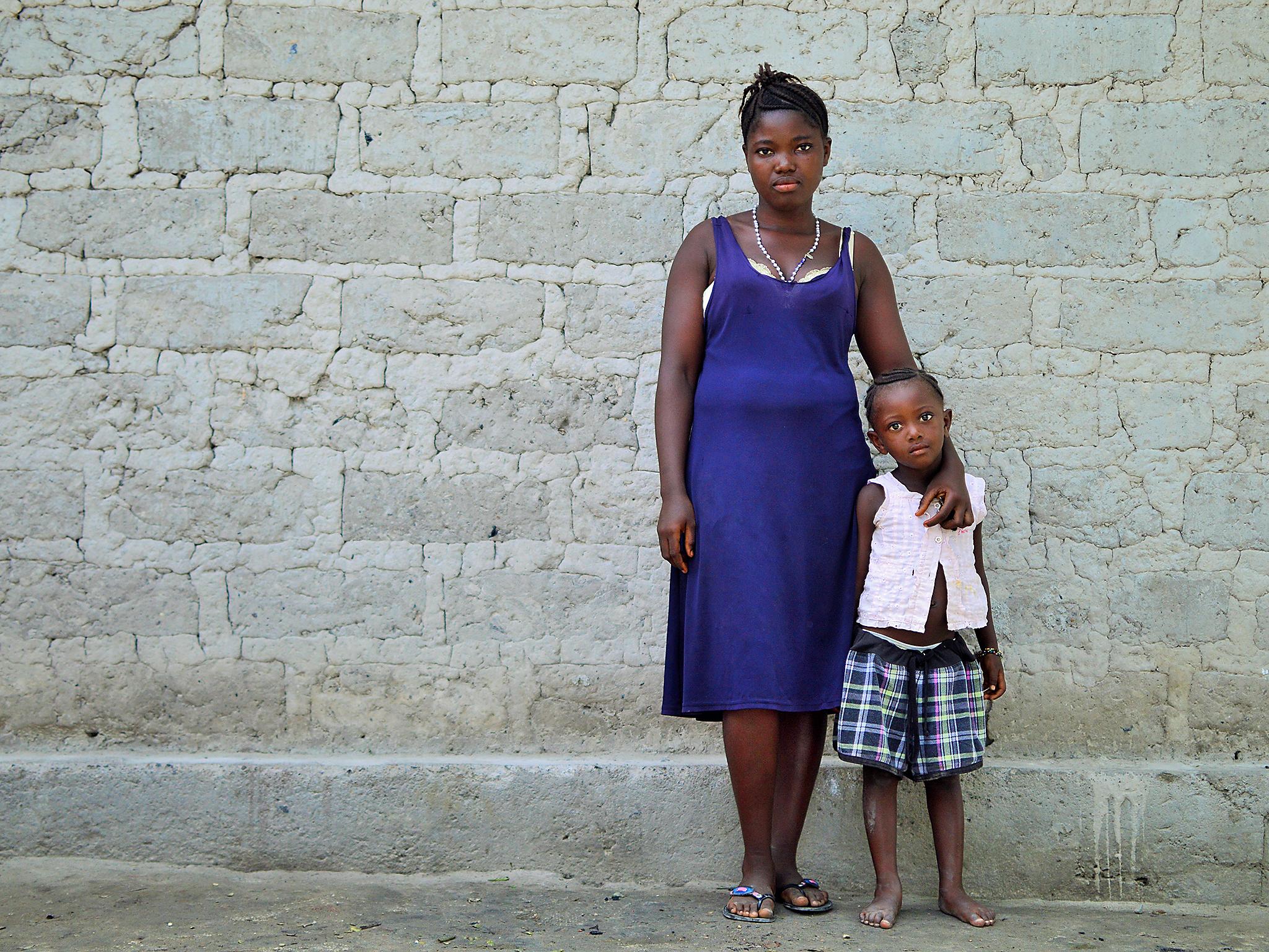 Kadiatu (left) exchanged sex for food in order to feed her family (Olivia Acland/Street Child)