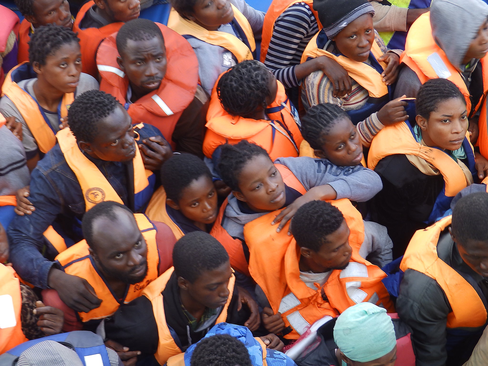 A refugee boat carrying 101 people being rescued by MSF's Bourbon Argos (Lizzie Dearden)