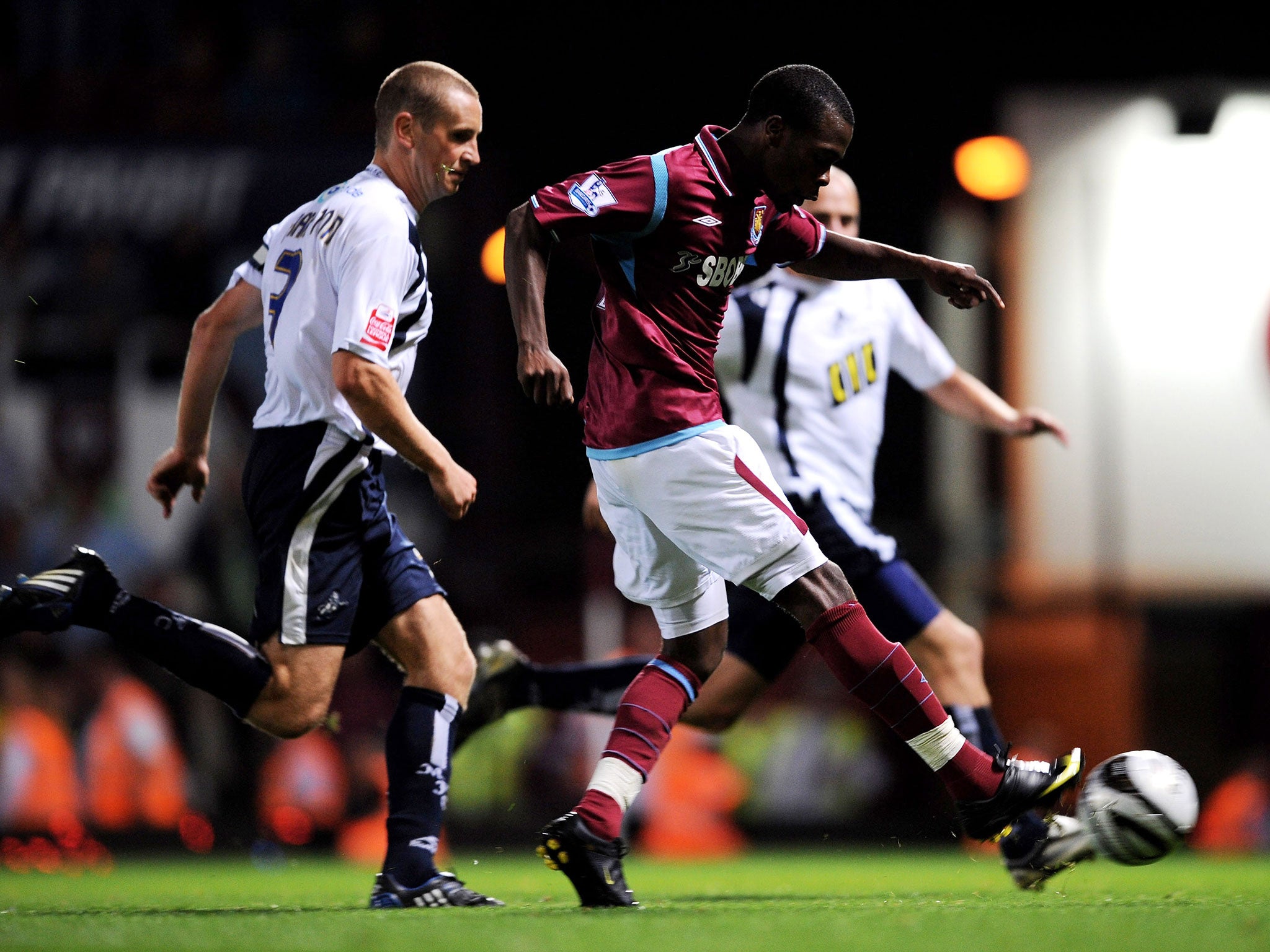 Zavon Hines takes him during the Carling Cup second round match between West Ham United and Millwall at Upton Park on August 25, 2009
