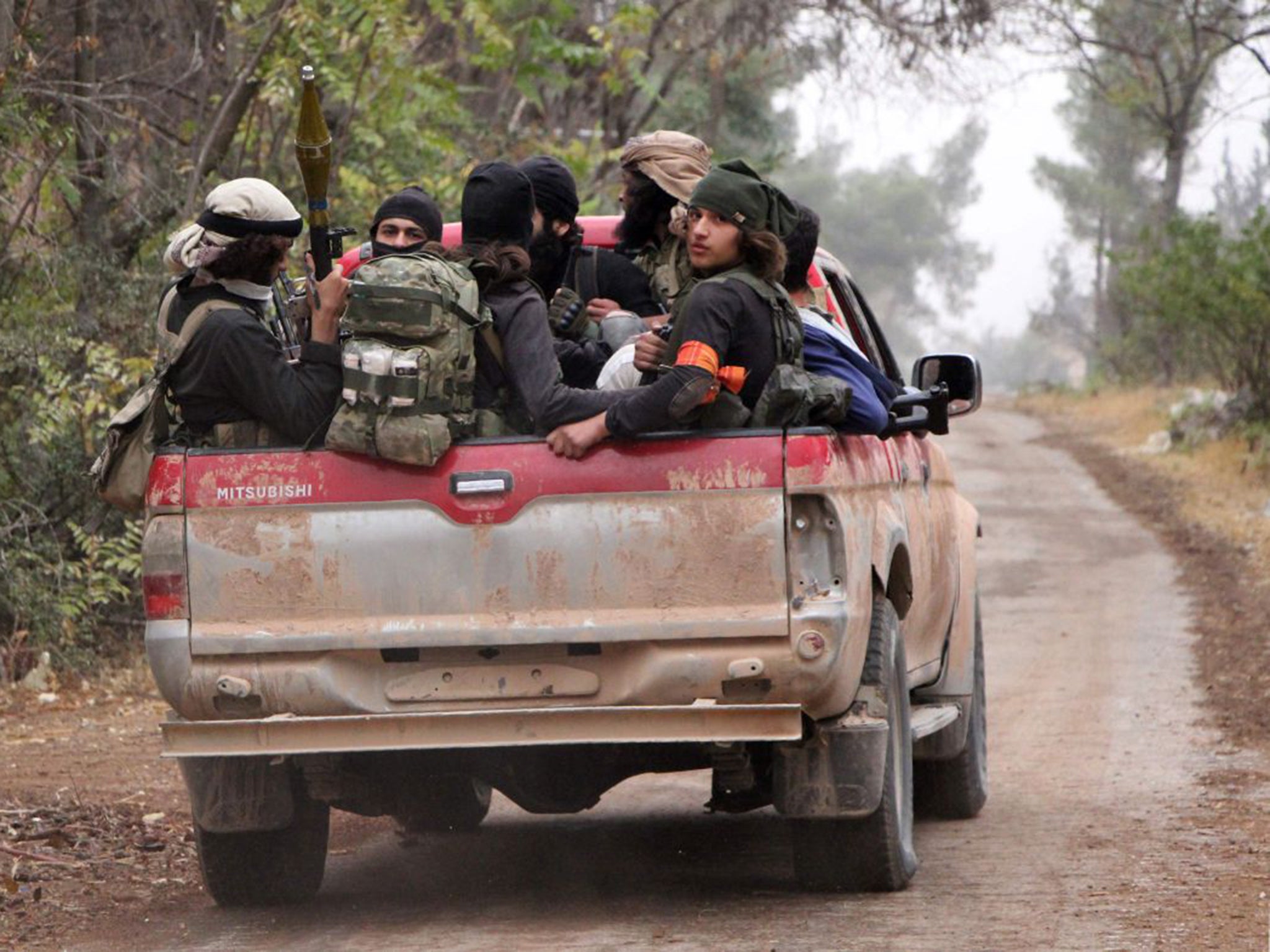 Members of Jaish al-Fatah brigades on their to take part in a major assault on Syrian government forces near Aleppo last week