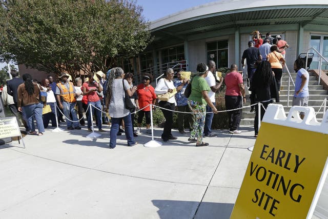 People in North Carolina queue up to cast their ballot in early voting