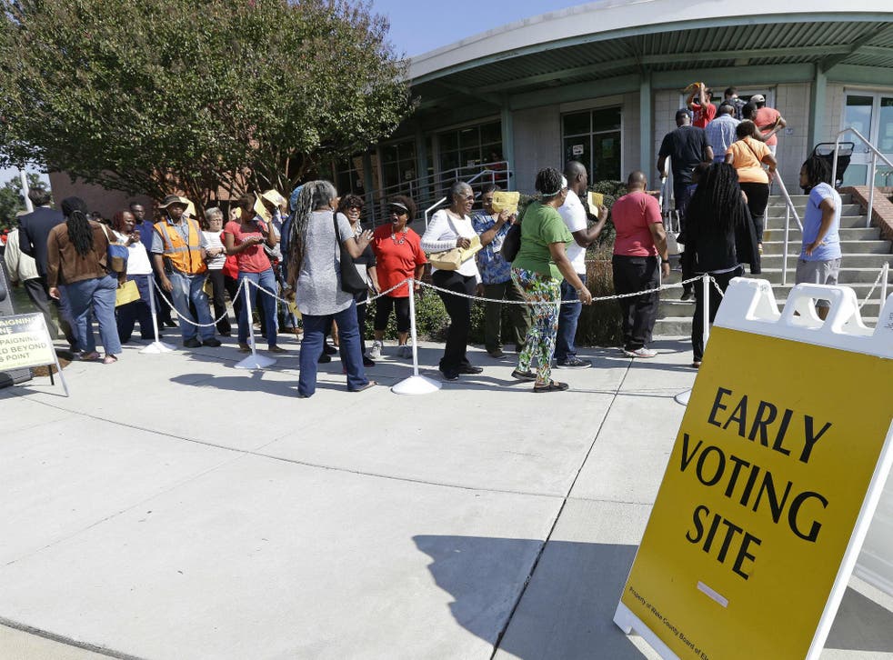 People in North Carolina queue up to cast their ballot in early voting