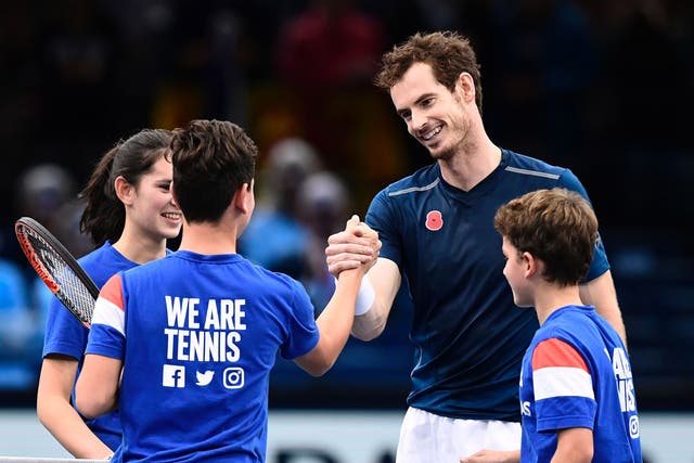 Andy Murray practiced with young players after his Paris Masters semi-final was abandoned