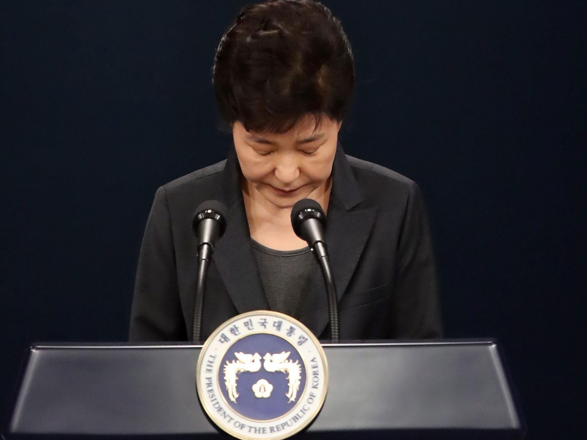 South Korean President Park Geun-hye bows in apology as she delivers an address to the nation about the scandal (EPA/Yonjap South Korea)