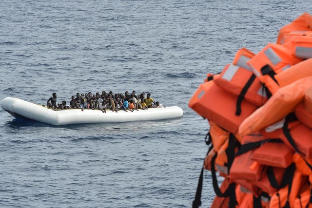 Migrants and refugees on a rubber boat wait to be evacuated during a rescue operation off the coast of Libya by the crew of the Topaz Responder, a rescue ship run by Maltese NGO "Moas" and the Italian Red Cross, on 5 November, 2016