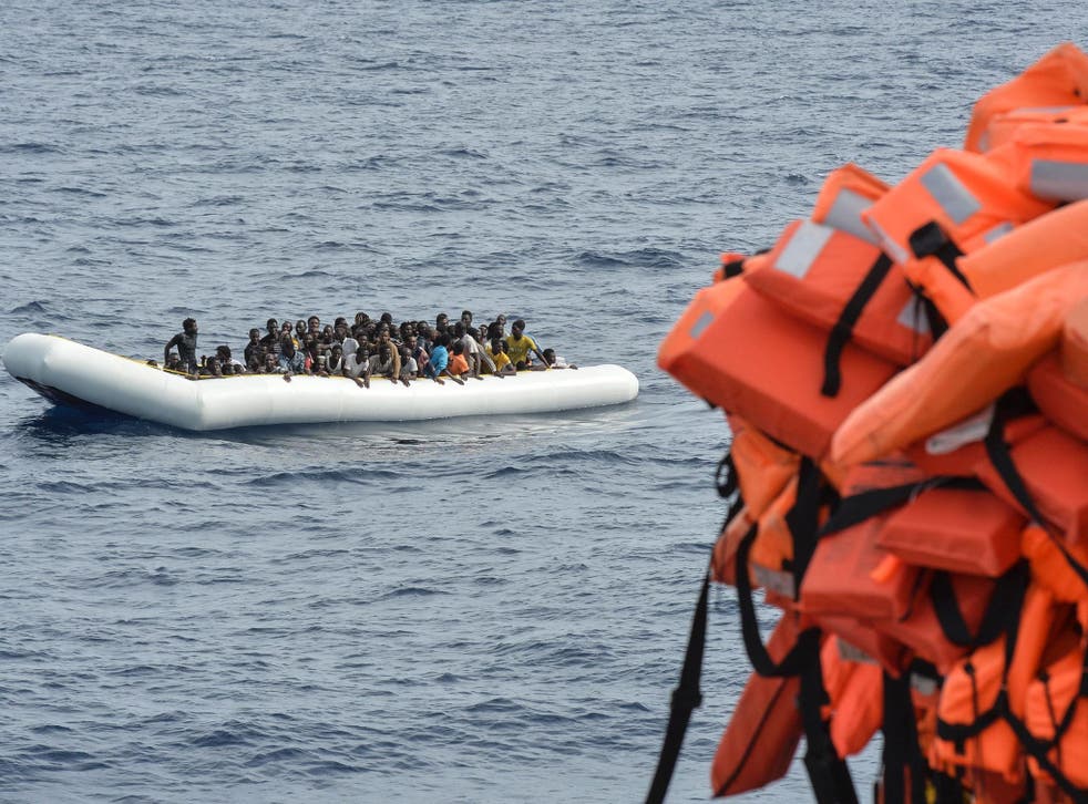 Migrants and refugees on a rubber boat wait to be evacuated during a rescue operation off the coast of Libya by the crew of the Topaz Responder, a rescue ship run by Maltese NGO "Moas" and the Italian Red Cross, on 5 November, 2016