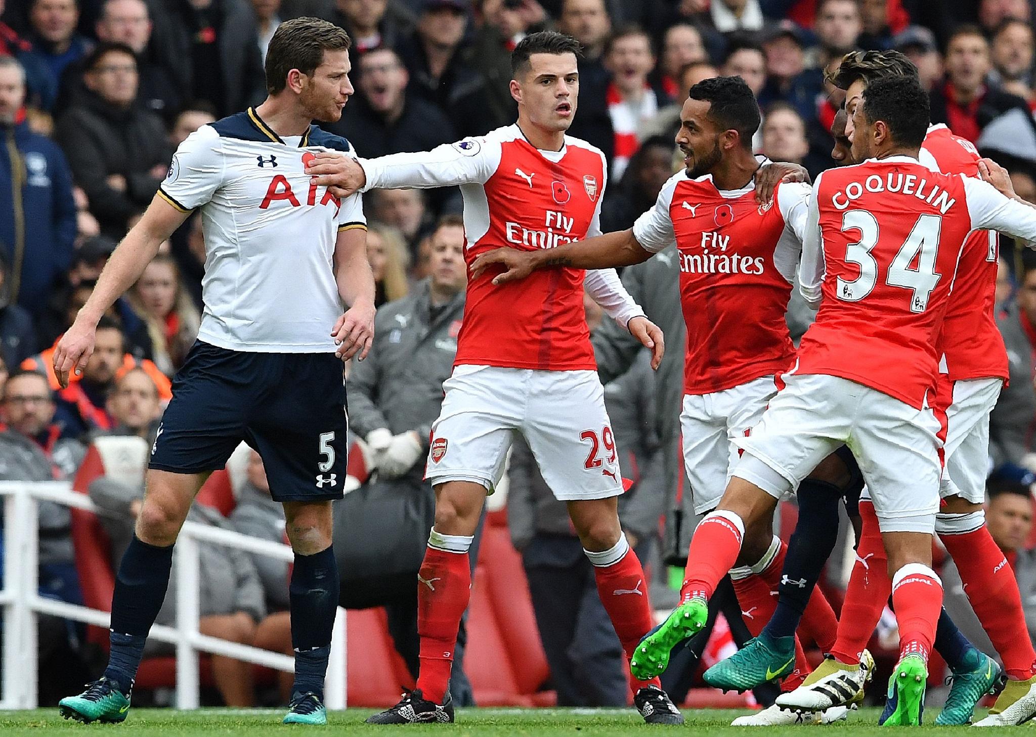 Jan Vertonghen clashes with a number of Arsenal players after Theo Walcott was fouled