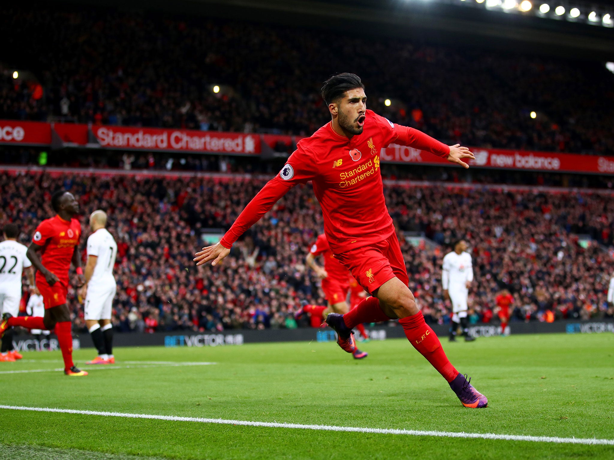 Emre Can celebrates his goal to make it 3-0