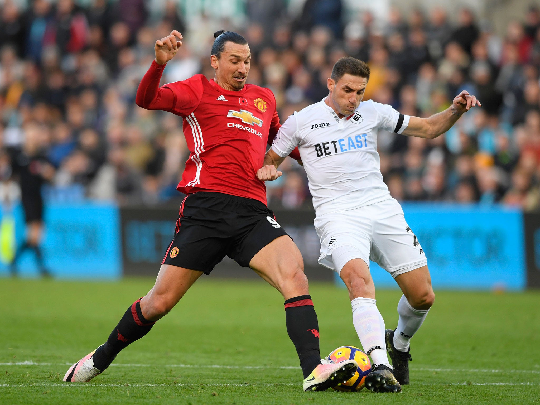 Zlatan Ibrahimovic and Angel Rangel challenge for the ball