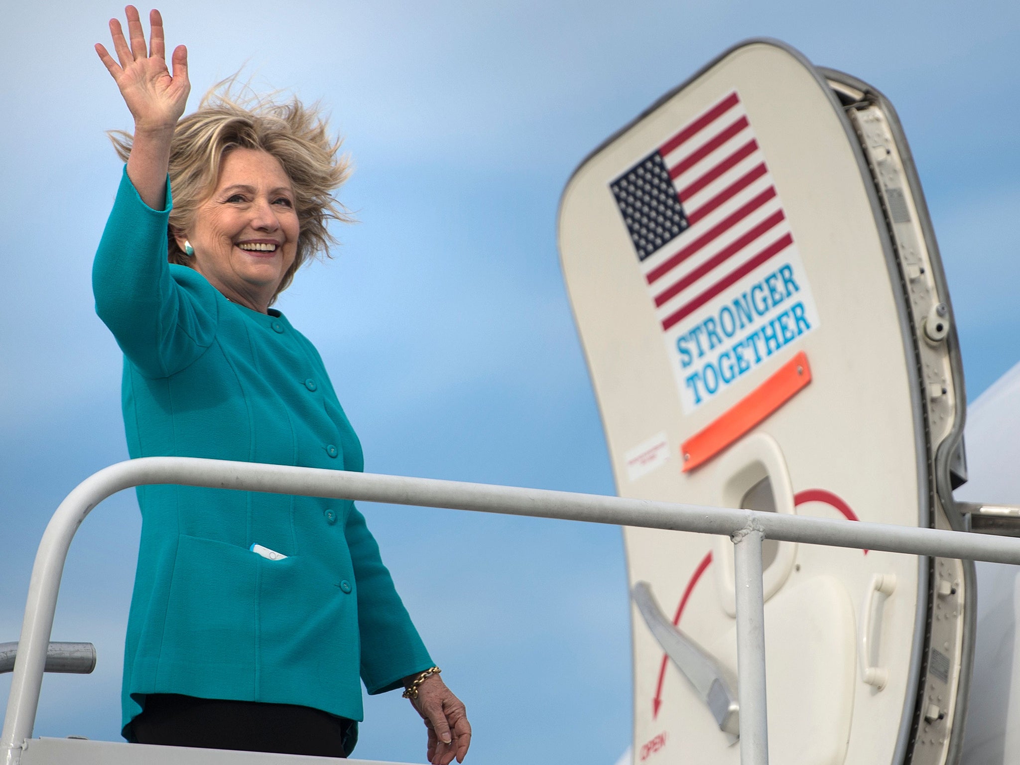 Hillary Clinton boards an aeroplane at Philadelphia International Airport on 6 November