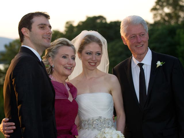 From left to right, Marc Mezvinsky, Hillary Clinton, Chelsea Clinton and former US President Bill Clinton pose during the wedding of Chelsea Clinton and Marc Mezvinsky at the Astor Courts Estate on 31 July, 2010, in Rhinebeck, New York