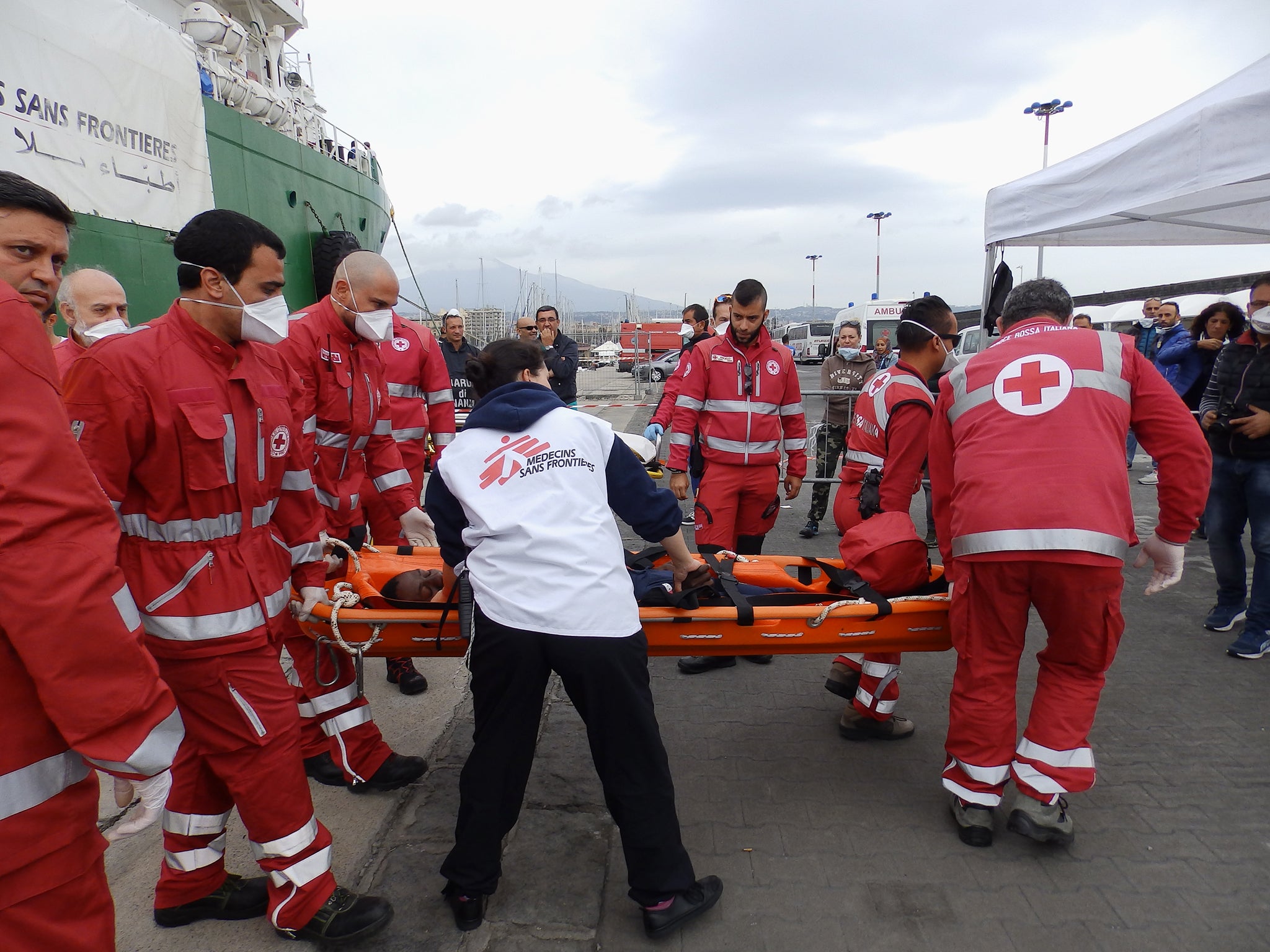 A man being taken to hospital from MSF rescue ship the Bourbon Argos in Catania, Sicily