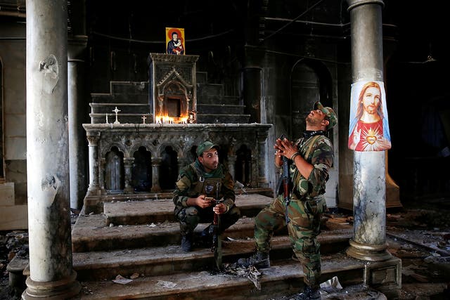 Iraqi soldiers at the Grand Immaculate Church in Qaraqosh, near Mosul