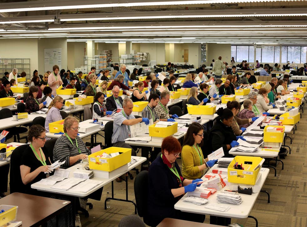 November 07, 2016Temporary elections employees open ballots at the King County Department of Elections in Renton, Washington