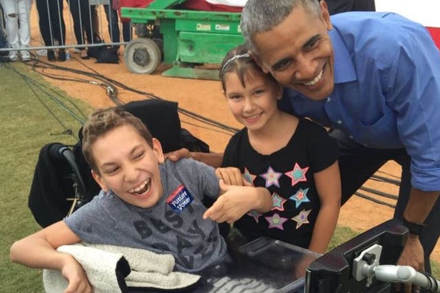 JJ Holmes with his sister, Grace, and President Obama