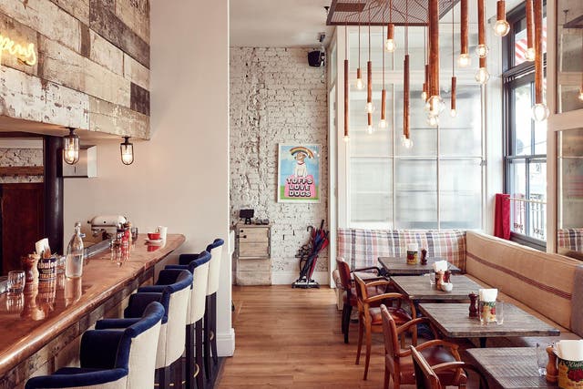Grab a perch at the copper-top bar that looks onto the open kitchen to watch the Cambridge Street café chefs at work