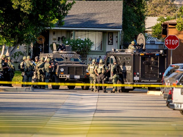 SWAT team moves in on a barricaded suspect on Fourth Street east of Orange Avenue after several people were shot at in Azusa, California