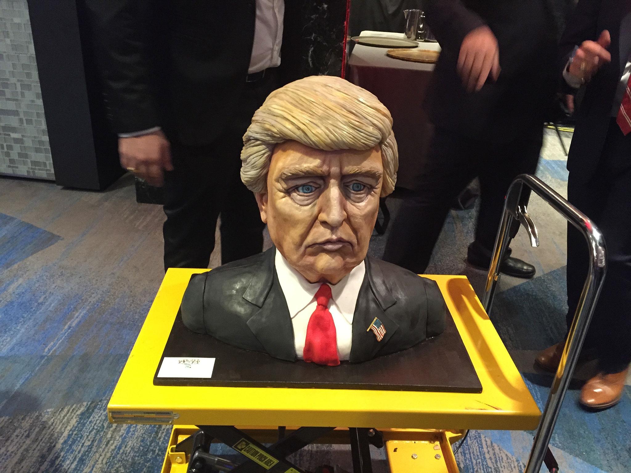 A cake moulded into the shape of Donald Trump's head, and made by Melissa Alt, 24, from New Jersey, delivered to his election night event, billed as the Republican's 'victory party' at the Hilton Midtown hotel in Manhattan, where Trump supporters have gathered to await the presidential election result