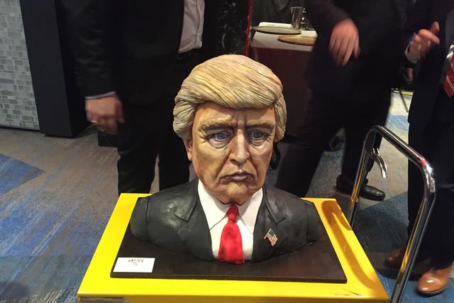 A cake moulded into the shape of Donald Trump's head, and made by Melissa Alt, 24, from New Jersey, delivered to his election night event, billed as the Republican's 'victory party' at the Hilton Midtown hotel in Manhattan, where Trump supporters have gathered to await the presidential election result