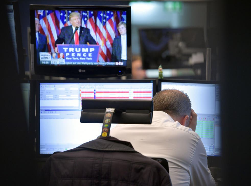 A trader in Frankfurt reacts with despair in front of Donald Trump’s celebration speech today