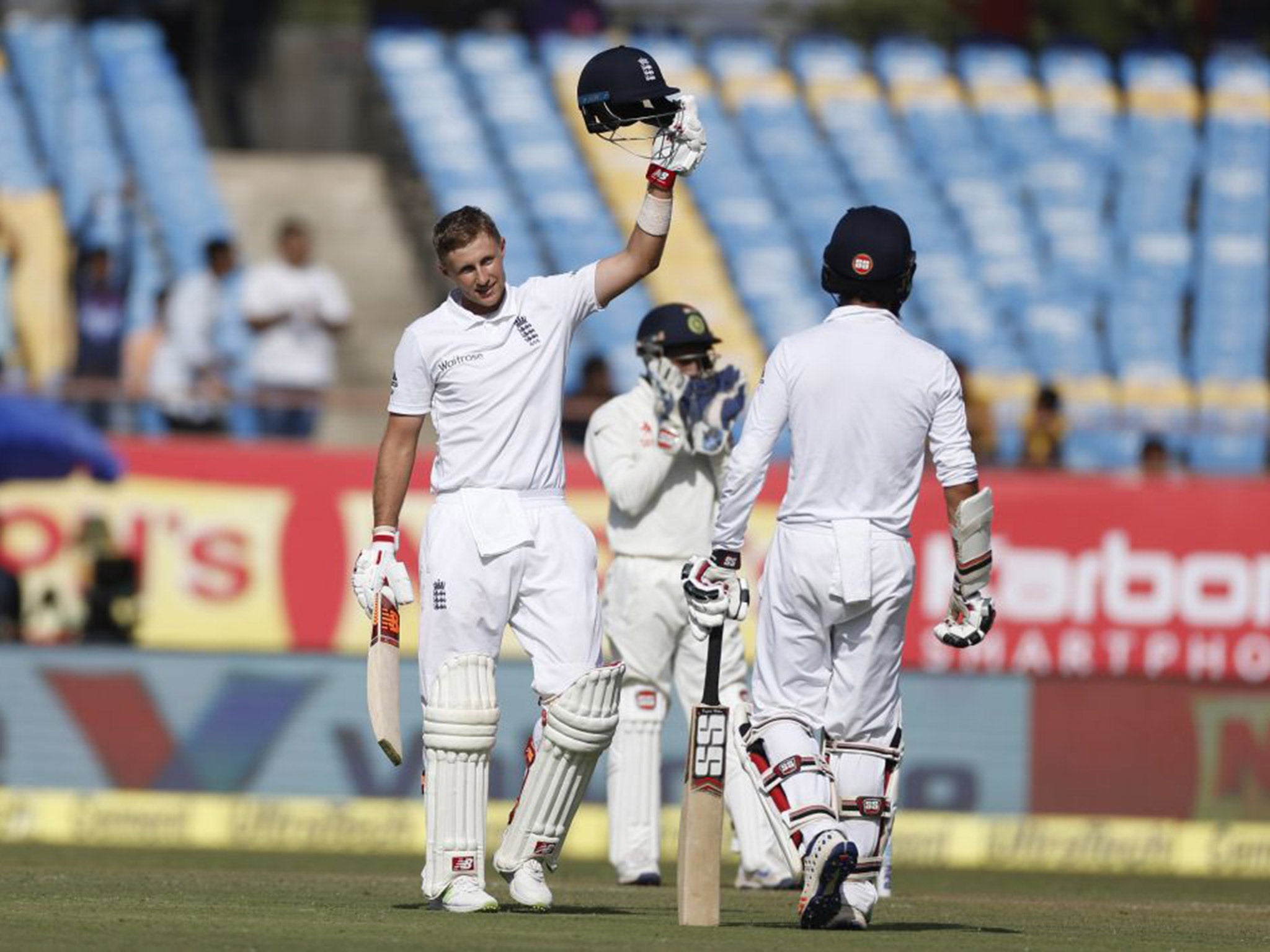 Joe Root salutes the crowd after reaching his century on day one of the first Test between India and England