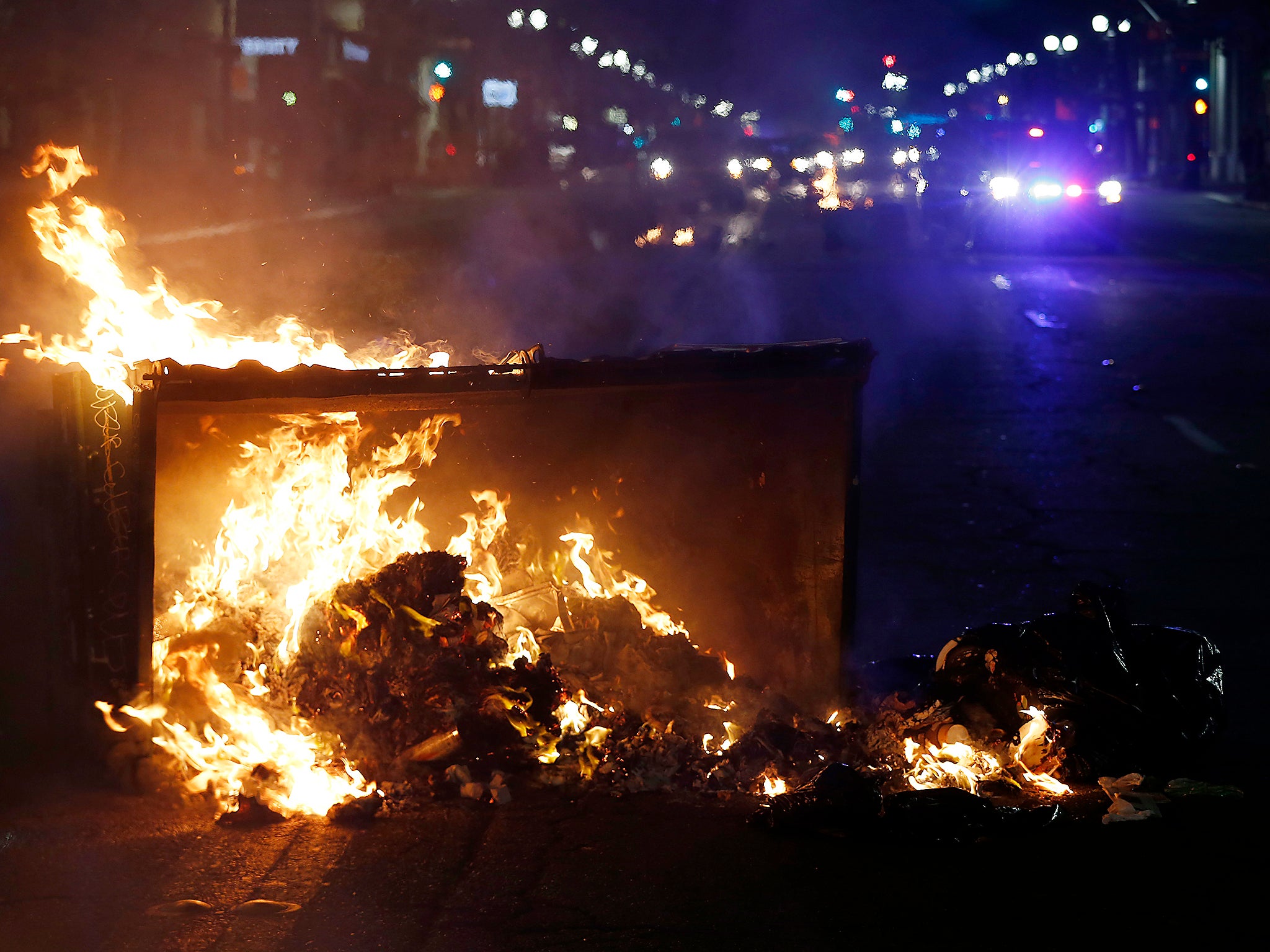 A fire burns during protests in Oakland, California