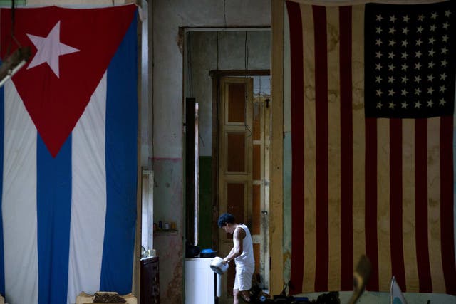 A US flag and a Cuban flag hang side by side