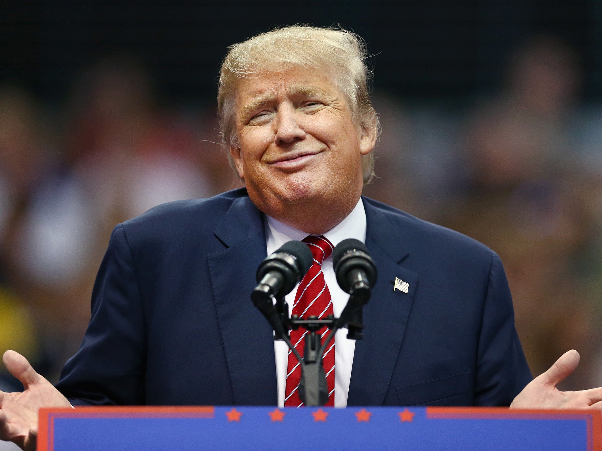 Donald Trump displays the 'zipped smile'