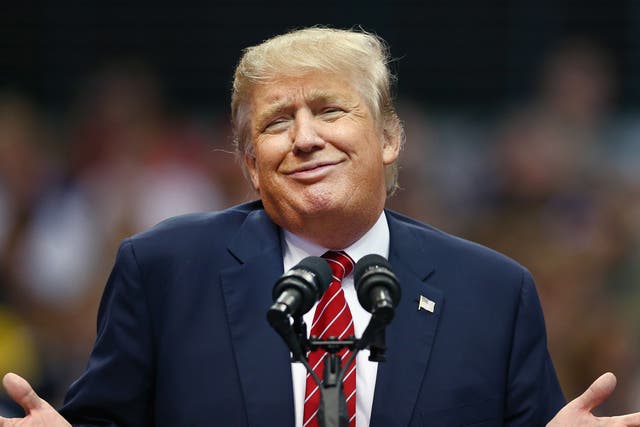 Donald Trump displays the 'zipped smile' 