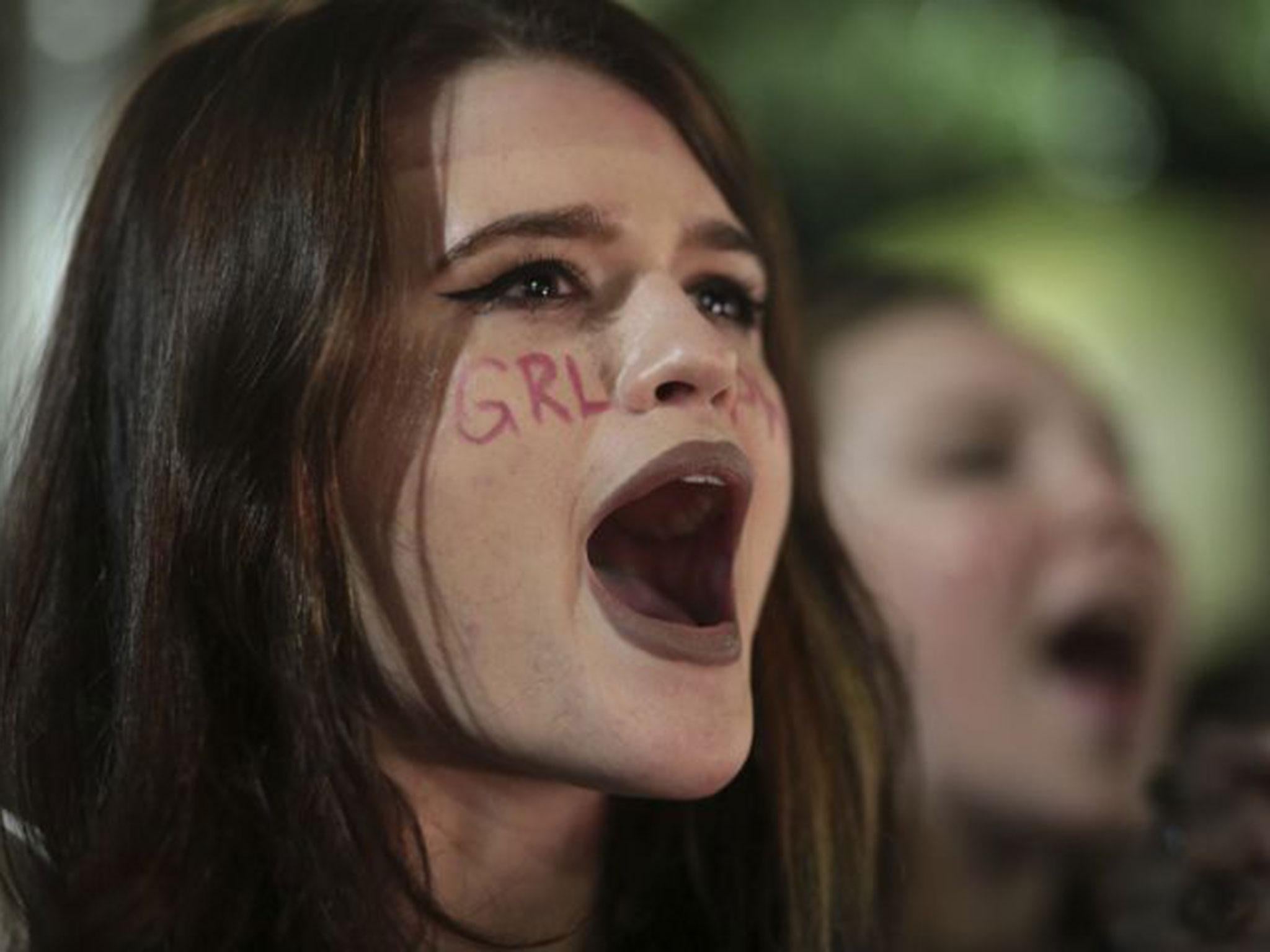 Morgan Riemersma chants "not my president" during a protest in opposition of Donald Trump's presidential election victory in Athens, Georgia