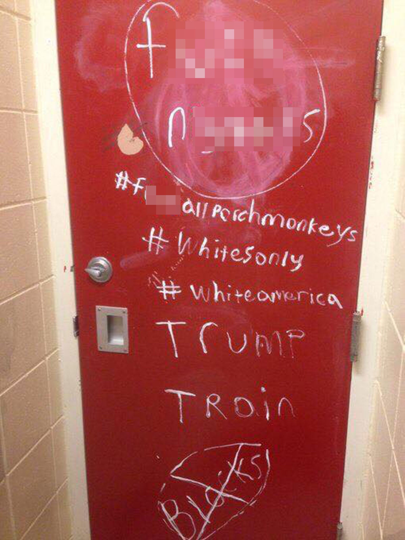 Racist graffiti left on a toilet door at Maple Grove Senior High School, Minnesota, on 9 November